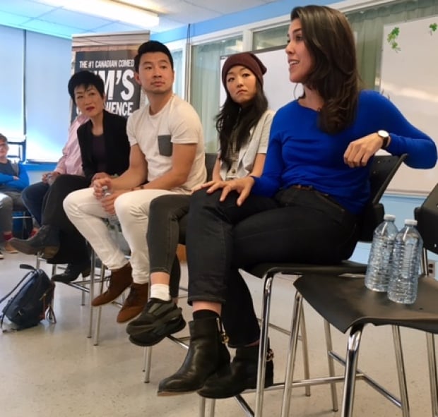Kim's Convenience star Nicole Power, right, of Logy Bay-Middle Cove-Outer Cove, chats with students from her old high school.(Jeremy Eaton/CBC)